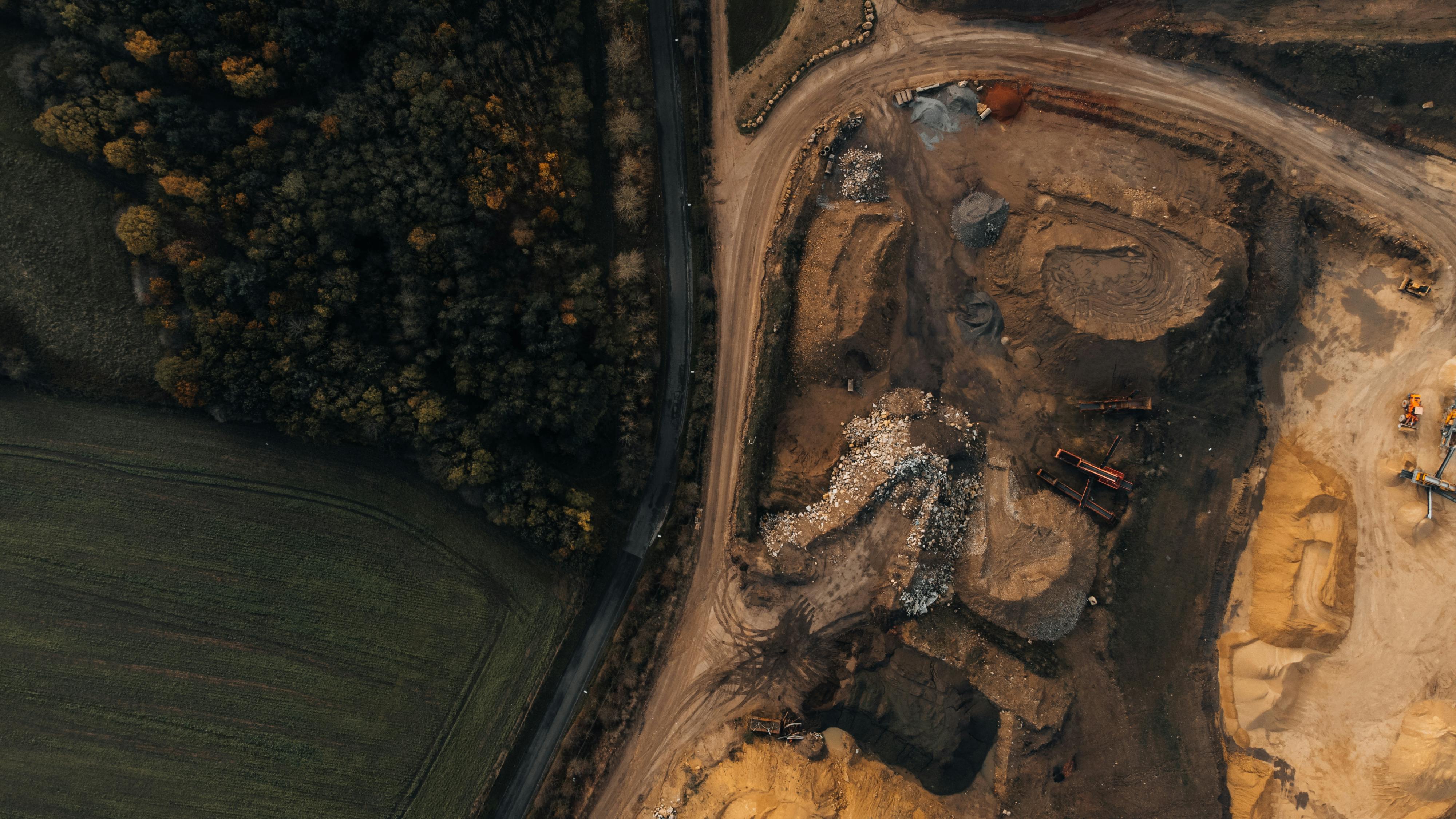 Excavation and digging work, representing groundwork and foundation.